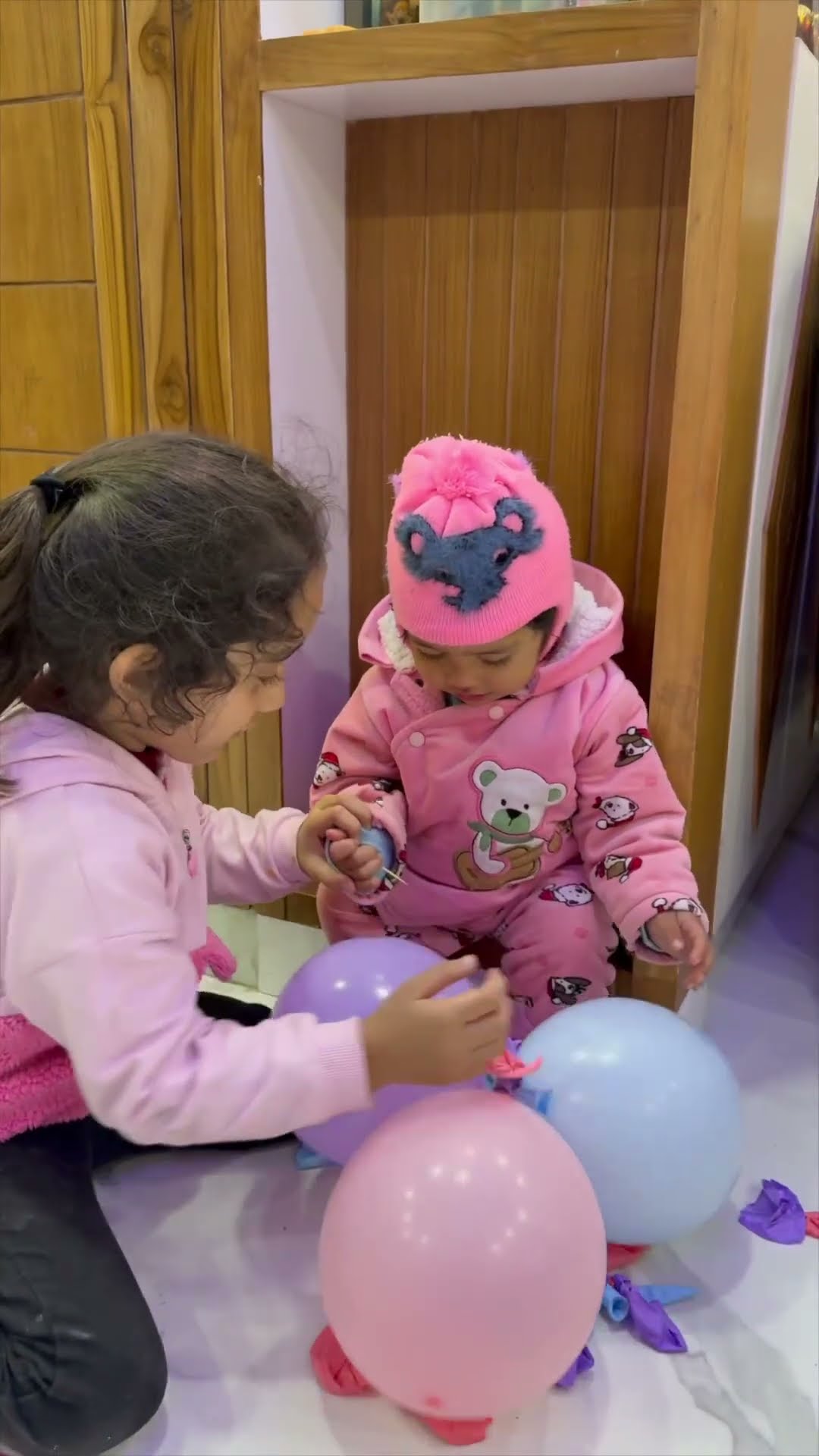 Cute baby balloon popping