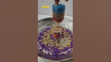 Colourful Pearls Drop from the Bottle. #reverse #satisfying #oddlysatisfying #asmr #shorts #pearls