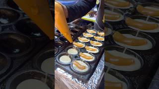 Small egg cakes with Thai tea custard filling -Thai Street Food