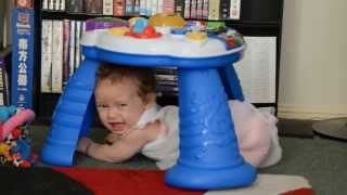 Isobel 42 Weeks, stuck under her Baby Einstein play table