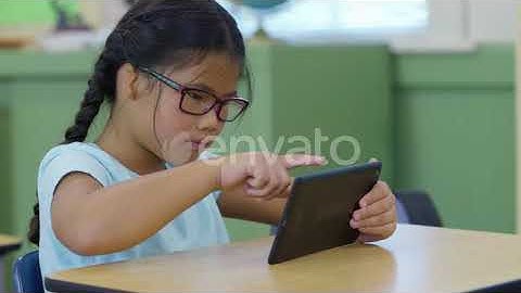 Student in school classroom using digital tablet | Stock Footage - Envato elements