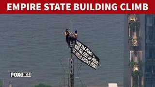 2 in custody after raising flag, proposing at top of Empire State Building spire