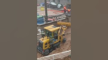 Man uses tractor to rescue three people trapped in floodwaters in Beijing
