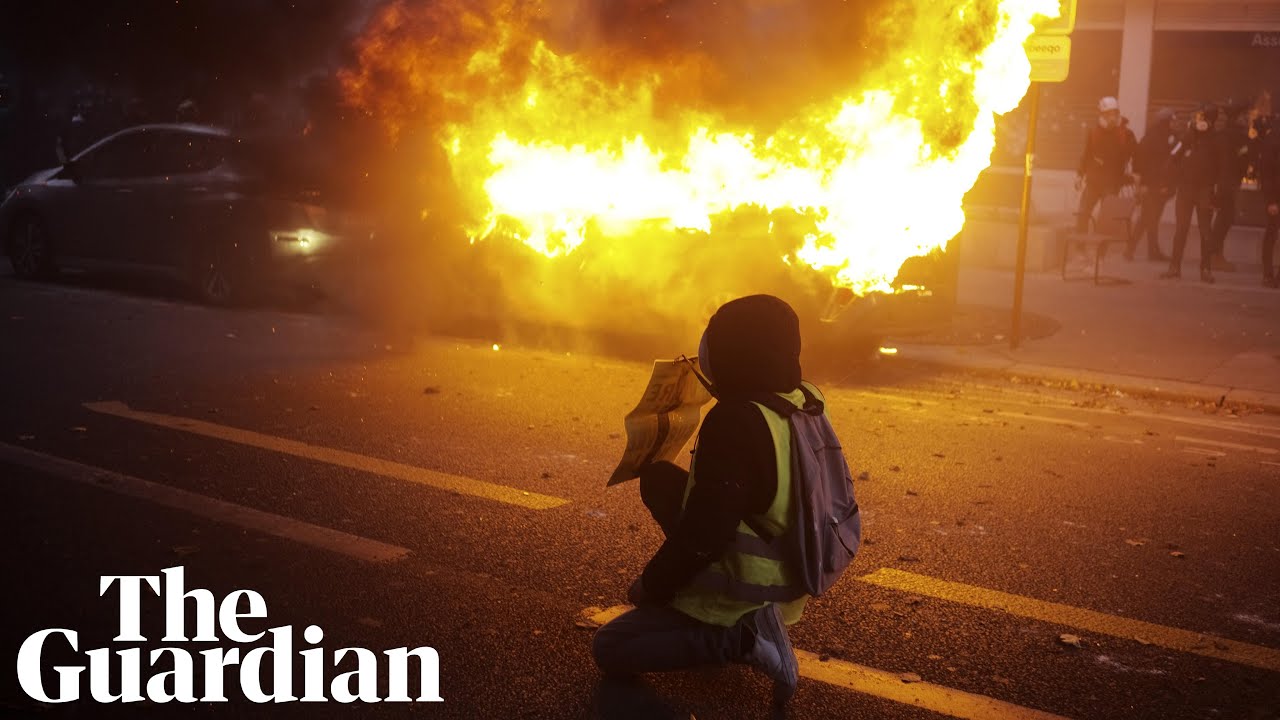 Vehicles set alight as thousands protest against police violence in ...