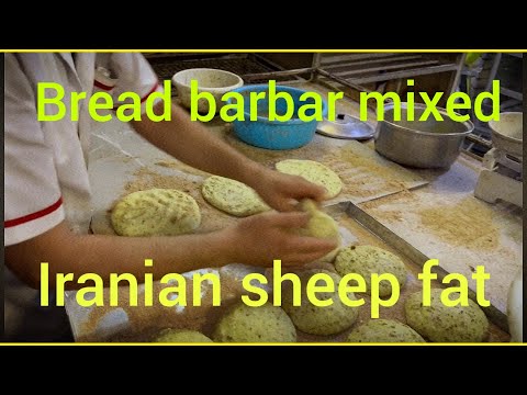 The method of cooking barbari bread mixed with sheep fat in Iran by a Pakistani baker