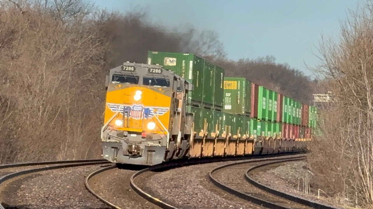 St Patrick’s Day morning in Winfield, IL. Eastbound Metras, hirail, UP1982 and UP9696