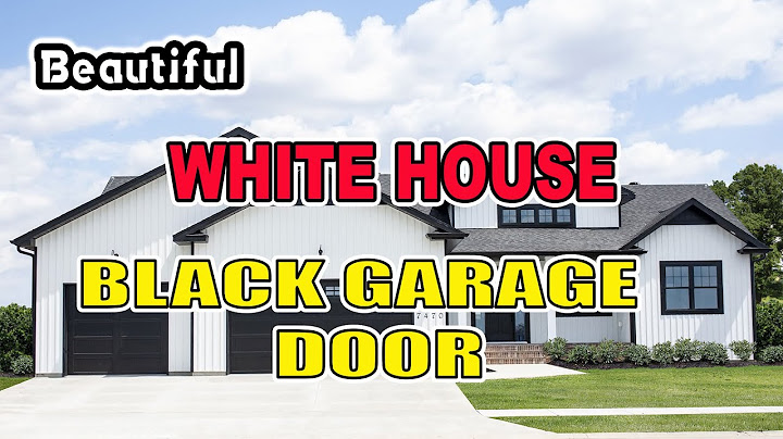 Brick house with black garage doors