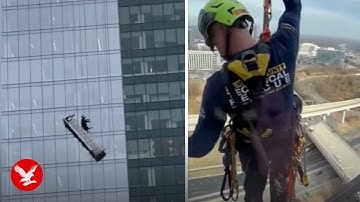 High-rise window cleaners dangle from 22-storey building after basket collapses