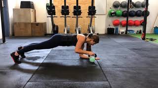 The Gym - Low Plank with Kettlebell Slide
