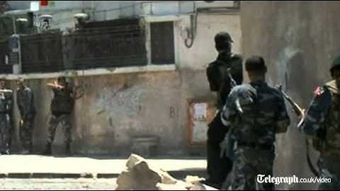 Soldiers fire at rebels in Damascus after suicide blast strikes Assad