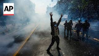 Protesters clash with police in Chile over planned education budget cuts