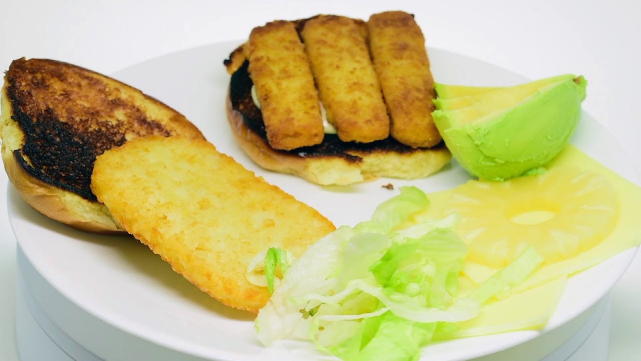 Friday Dinner. Cheesy fish finger burger with avocado 🥑 and pineapple 🍍