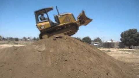 Dozer Skills / How to top a hill under control