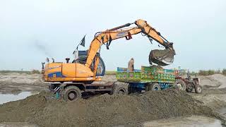 Samsung excavator working at river side sand loading||samsung excavator
