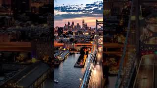 Ben Franklin Bridge and Philadelphia skyline transitioning from sunset to dusk.