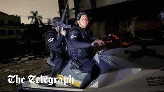 Armed Police Patrol On Jet Skis As Crime Rises In Flood-Hit Brazil