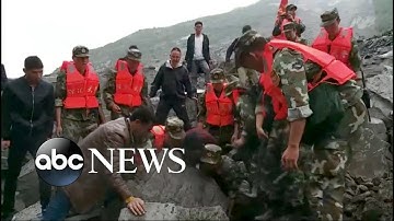 Desperate search for landslide survivors in China