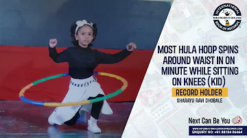 MOST HULA HOOP SPINS AROUND WAIST IN ONE MINUTE WHILE SITTING ON KNEES KID