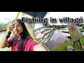 Catching local fish with net in village