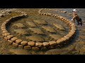 The girl arranged the stones in the stream in a circle to catch fish. She caught a lot of carp.