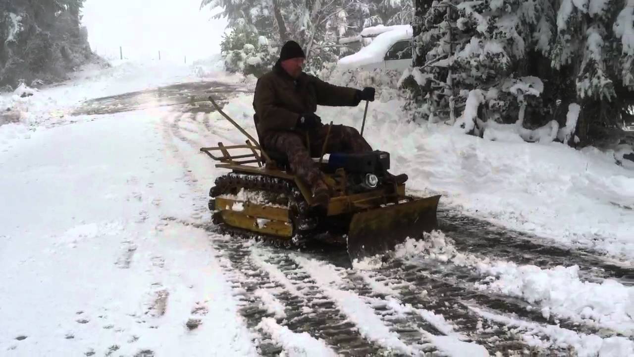 1947 Agricat clearing snowplow berm. YouTube