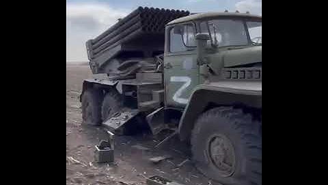 destroyed russian  military vehicle, Nikolaev Ukraine, civil buildings March 2022 russian terror