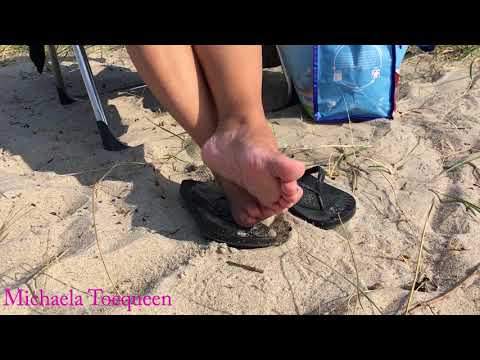 Michaela Toequeens barefeet relaxing at the beach.