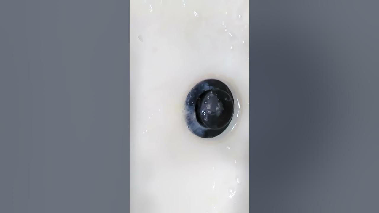 coughing-up-yellowish-mucus-in-the-sink-and-letting-it-ooze-down-the