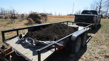 Unloading 2 yards of mushroom dirt off our trailer the easy way.Epic fail then success