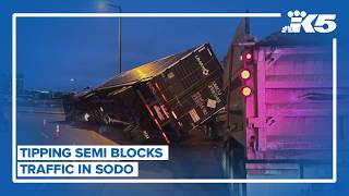 Tipped semi-truck blocks I-90 on ramp in SoDo