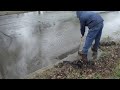 Unblocking a Clogged Street Drain for Safe Traffic Flow