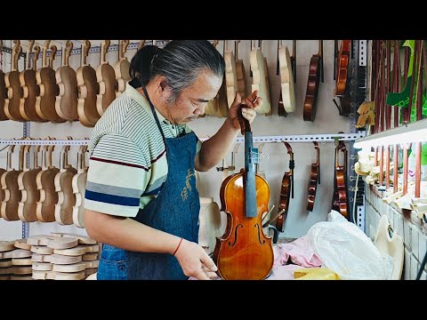 The process of making a violin by hand, a professional