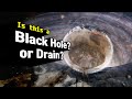 Falling into a drain? or into a black hole?!