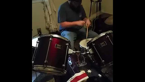 Derek Malone jamming on drums