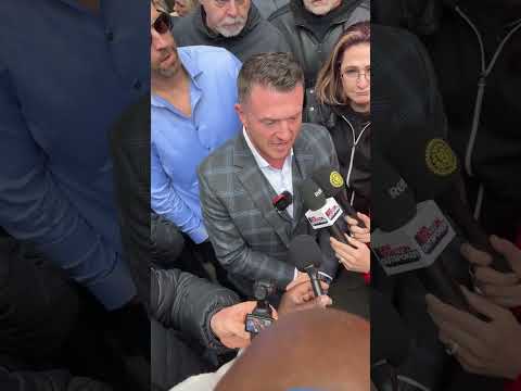 Tommy Robinson appears in court charged with terrorism for not giving his phone pin to the police