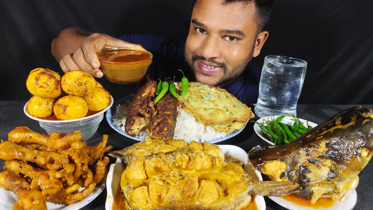 Spicy fish  curry, fish fry  and egg curry egg fry  with rice eating show ,indian  food eating video