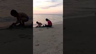 Playing in the sand with my son #sunset #sunsetview #sand #beach #sea #moments Resimi