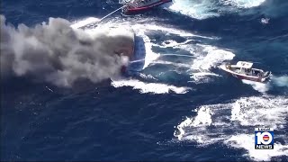 Fire crews worked to quickly extinguish a blaze aboard a boat off Hallandale Beach