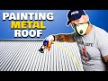 Painting a Metal Roof. Painting with an airless paint sprayer.