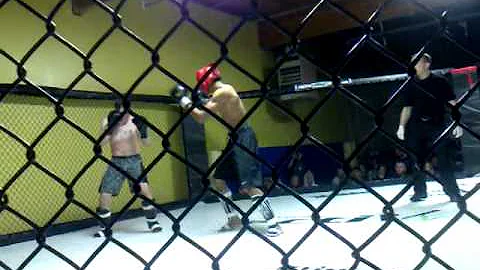 Ricky Satterwhite (black trunks red head gear)