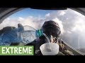 Fighter jet pilot drinks water cup while flying upside down