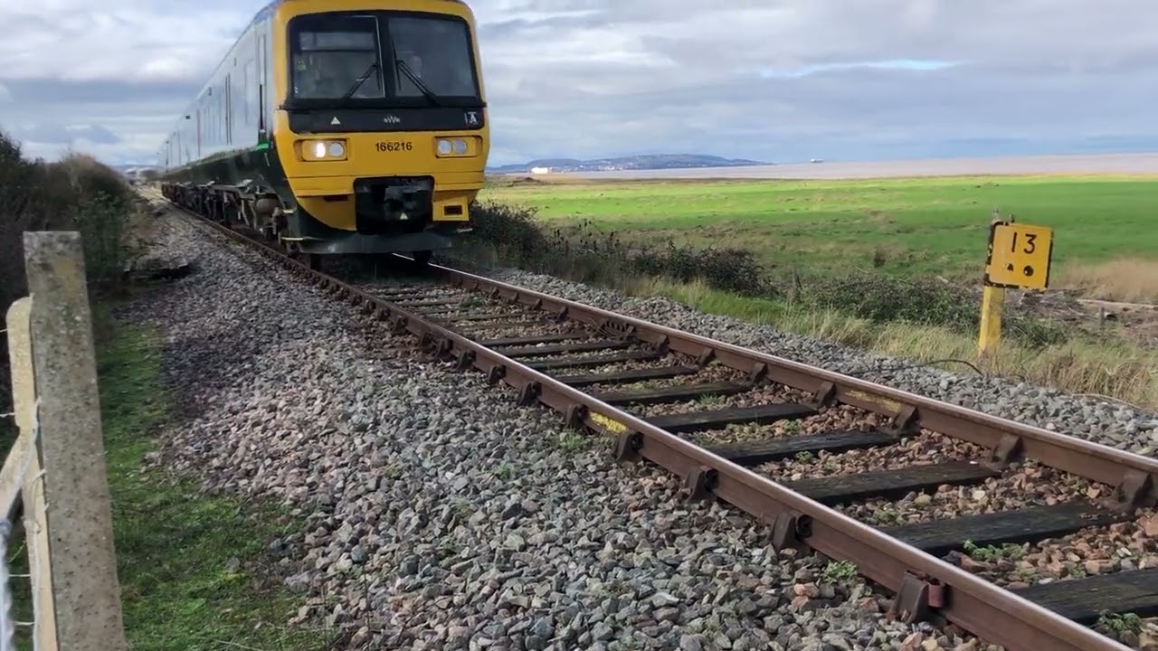 Clickity-click! 166216 on a rare piece of jointed track with wooden sleepers and chairs in Bristol