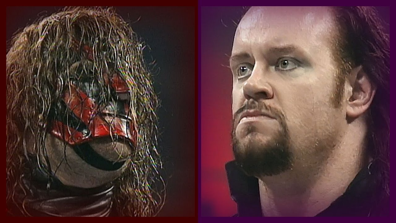 The Undertaker Helps Kane Clear the Ring 122997