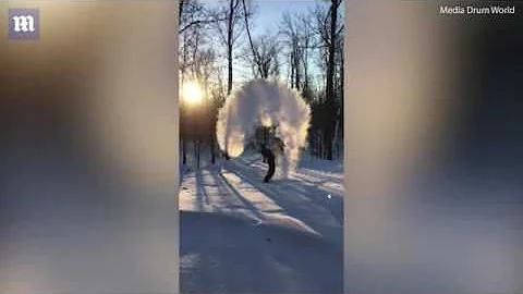 Amazing moment man throws boiling water into cold air creating snow