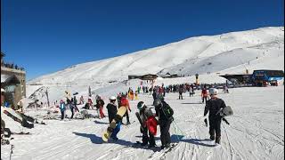 Snowboarding down El Rio ski slope, Sierra Nevada Spain