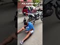 police man hitting biker