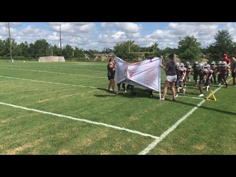 tough-football-banner-prevents-team-entrance-||-viralhog