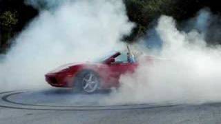 Http://www.symbolsofsuccess.com professional race car driver justin
bell, puts this ferrari 360 spider into a perfect donut burnout. the
tire tracks leave ...