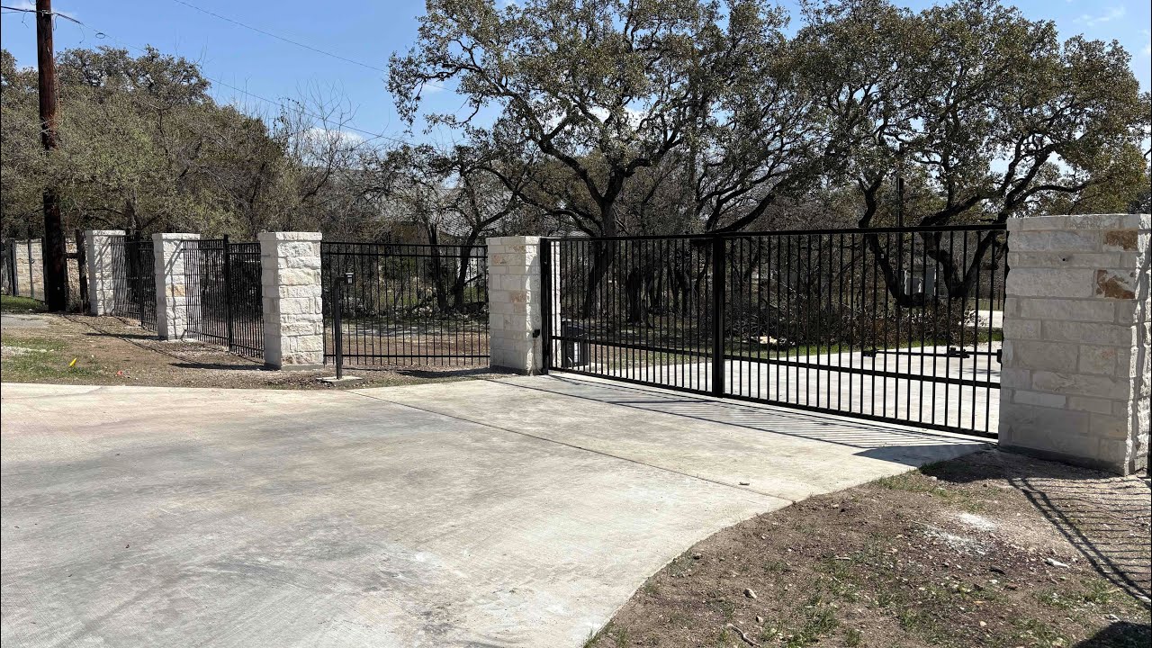 Steel fence with stone columns build - YouTube