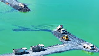 EP1401, Many SHACMAN Transport Rock filling In Lake With SHANTUI DH17 And Wheel Loader Push Rock